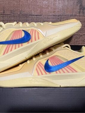 Nike Yellow Running Shoes with Metallic Blue Swoosh and Pink Accents
